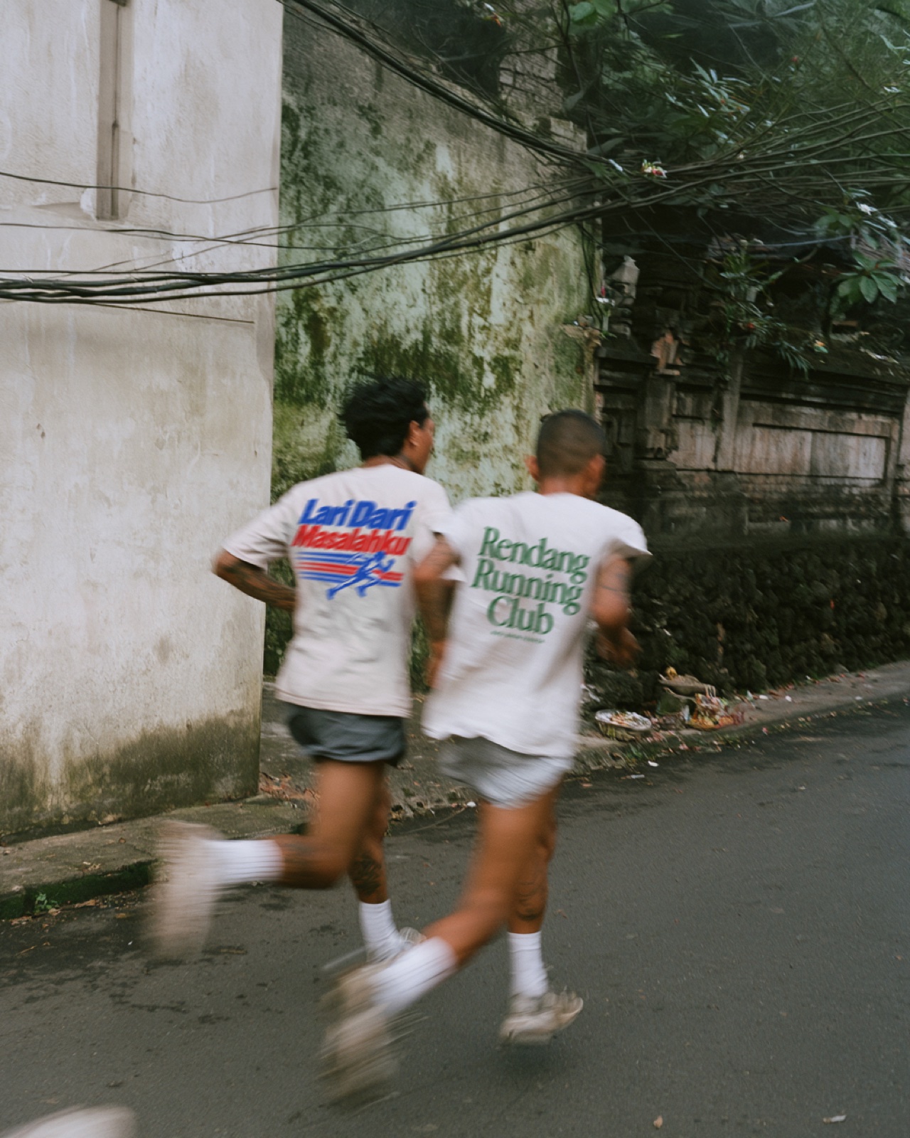 Friends running together in Lari Dari and Rendang tees